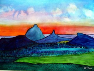 A  painting by Valarie Ross Mountains and Sunrise with main colour being Blue Orange and Red and titled sunrise over Glasshouse Mtns