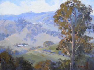 An Oil painting by Trish Bennett in the Impressionist style  depicting Landscape Mountains and Trees with main colour being Blue Ochre and Olive and titled Patchwork landscape