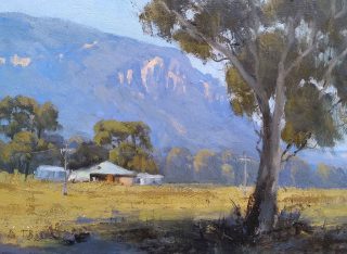 An Oil painting by Trish Bennett in the Realist Impressionist style  depicting Landscape Farm Cottage Mountains and Rural with main colour being Blue Brown and Ochre and titled Picturesque